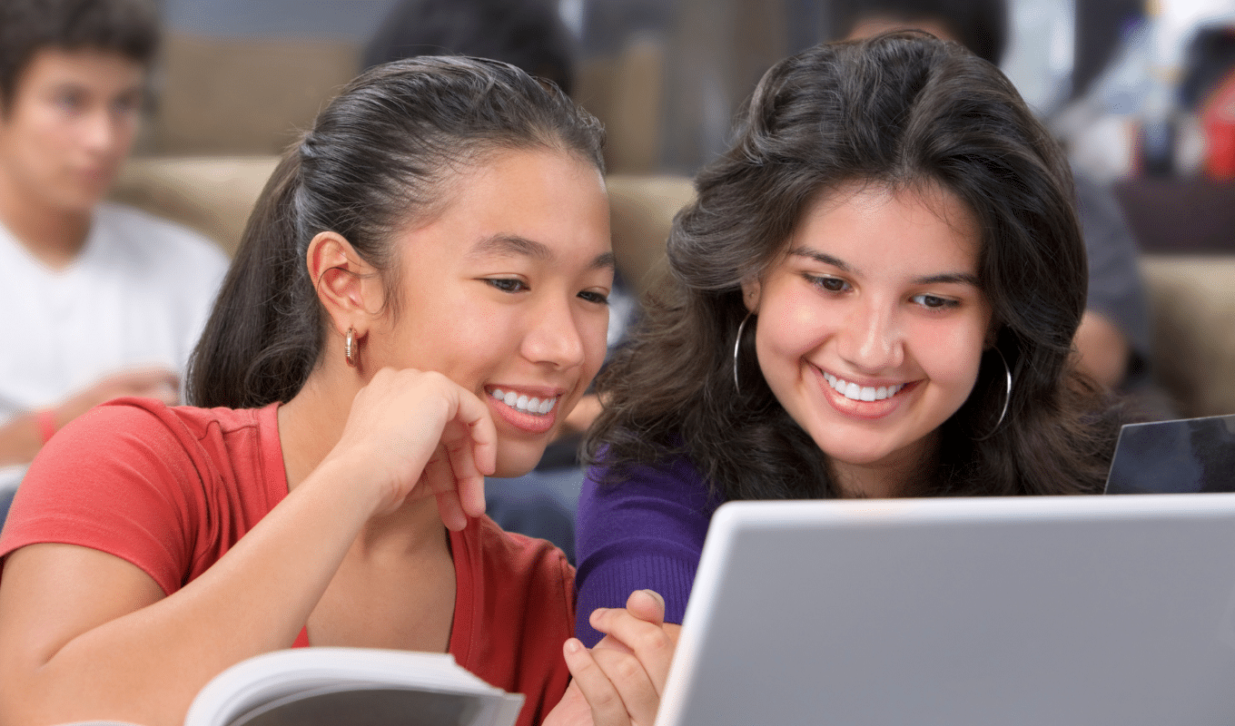 Two smiling girls used for virtual care page | Advanced Orthodontics in Burien, WA